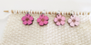 Cherry Blossom Stitch Markers shown on knitting