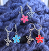 Hummingbird and Flower Stitch Markers for Crocheting or Knitting shown on crochet scarf