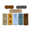 Eight assorted colours and designs of PU vegan polyurethane leather garment label tags for knitted and crocheted projects sold by Pretty Warm Designs Inc.