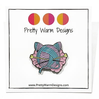 Pink, turquoise and yellow enamel on black background cat shaped yarn knitting pin by Pretty Warm Designs