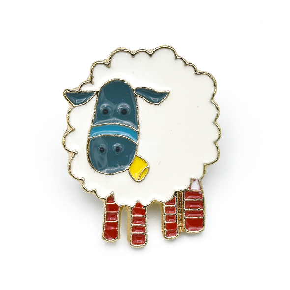 White, teal, yellow and red enamel on gold toned metal sheep pin by Pretty Warm Designs