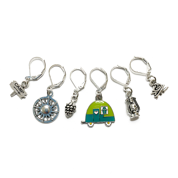 Set of one two-toned green and silver enamel tiny camper and five antiqued silver camping themed crochet stitch markers on silver plated lever back clasps for crochet by Pretty Warm Designs