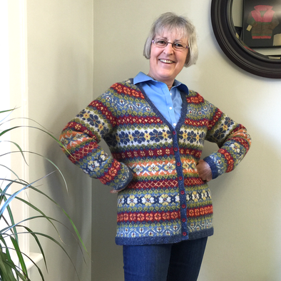 Janet Rice-Bredin of Pretty Warm Designs wearing her hand knitted Hedgerow sweater