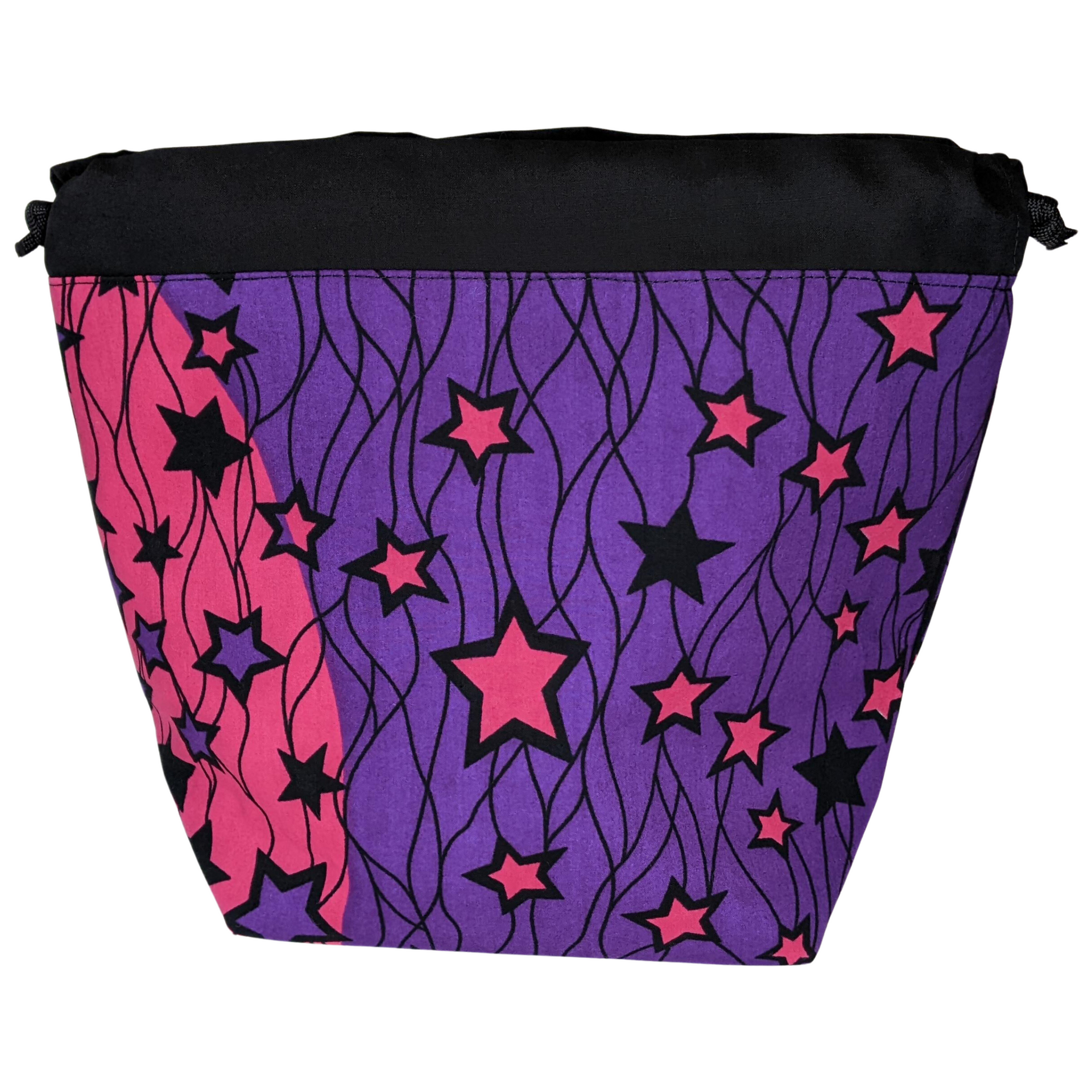 Handmade drawstring project bag in bold purple and pink African Kitenge textile with black and pink star pattern