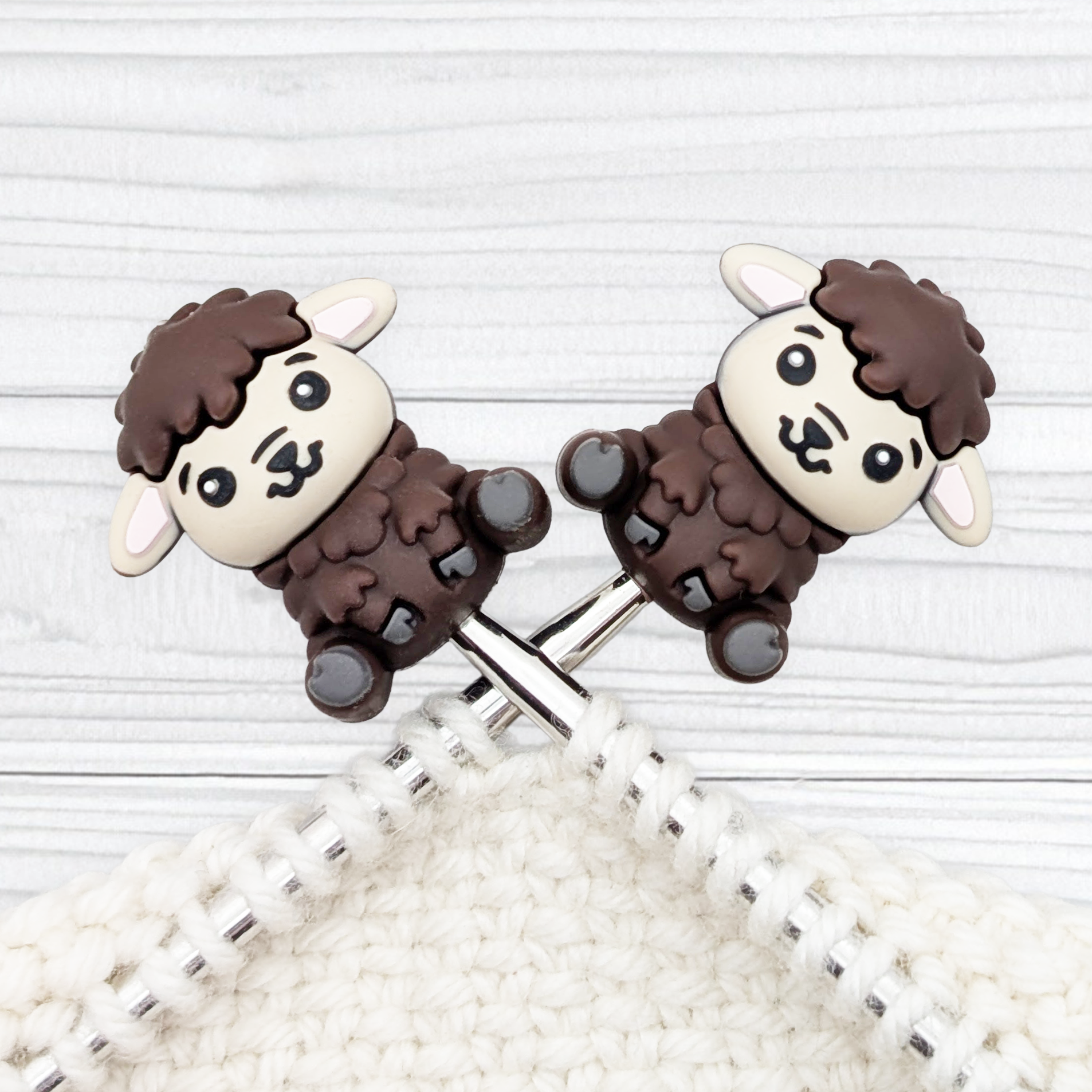 Mocha Feeling Sheepish sheep stitch stoppers on crossed knitting needles