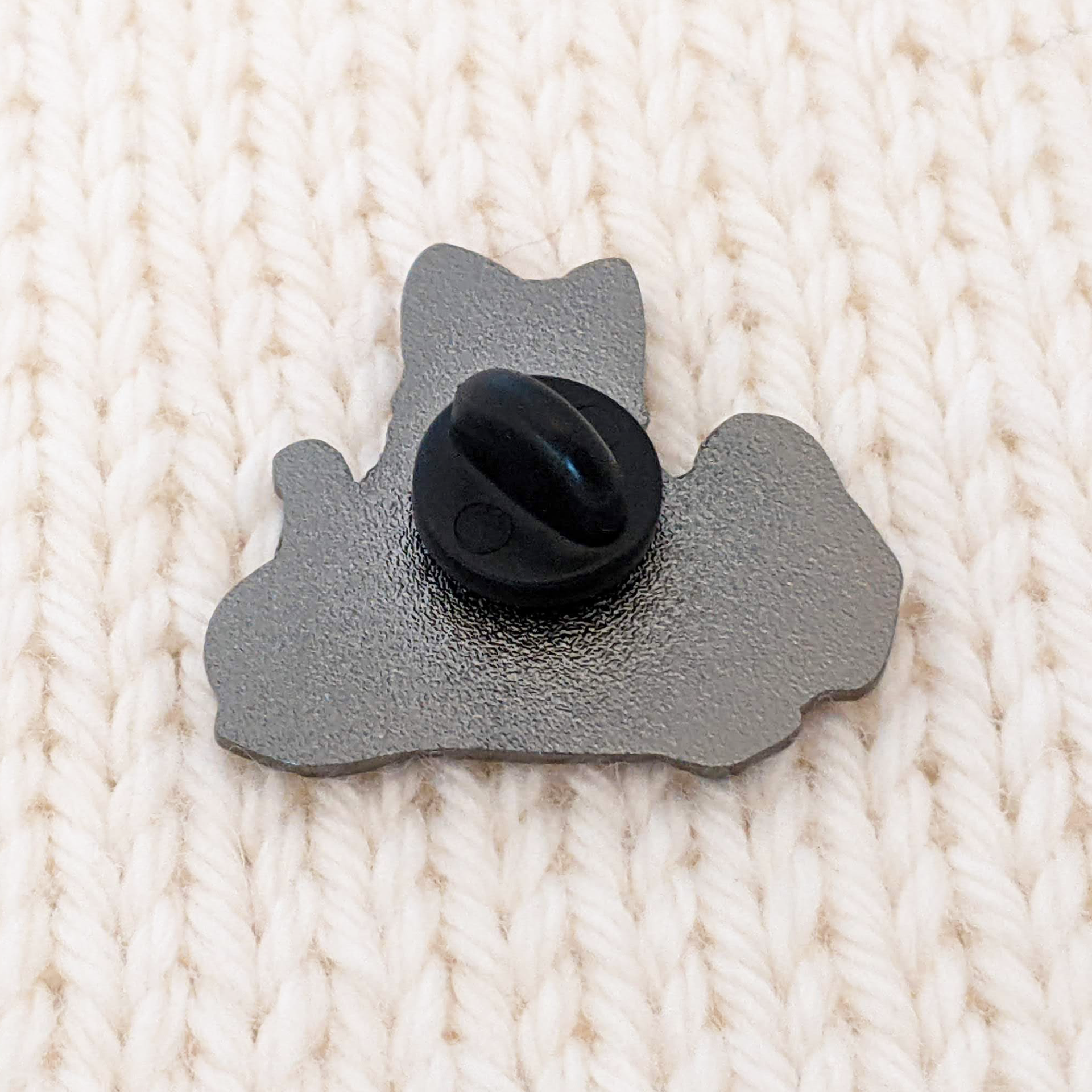 back of calico kitty enamel pin