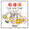 Set of six white, yellow and green enamel metal daisy charms with lever back clasps stitch markers for crochet by Pretty Warm Designs