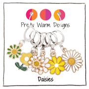Set of six white, yellow and green enamel metal daisy charms with lever back clasps stitch markers for crochet by Pretty Warm Designs