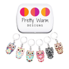Set of six multicoloured enamel on silver toned alloy owl locking stitch markers with decorative tin for crochet by Pretty Warm Designs