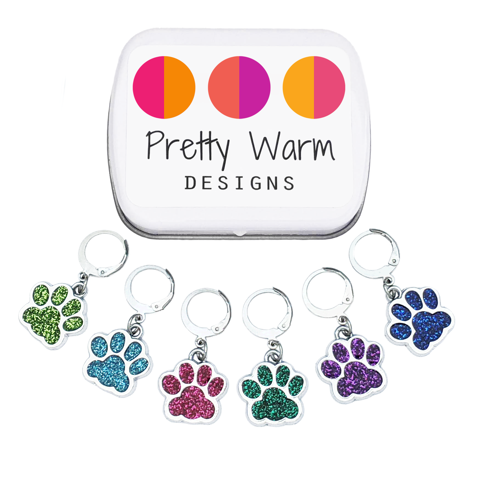Pretty Warm Designs Sparkle Paws locking stitch markers for knitting and crochet. A full set of six glitter enamel paw print charms in green, light blue, magenta, dark green, purple, and dark blue are arranged beneath a white notions tin displaying the brand logo. Features 316 stainless steel leverback locking clasps.