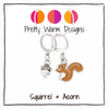 A brown enamel squirrel and silver acorn charm locking stitch marker duo, shown on a Pretty Warm Designs product card.