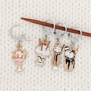 Set of 4 Ice Cream Sundae Locking Stitch Markers for crochet or knitting by Pretty Warm Designs, shown on a knitting needle with an open clasp
