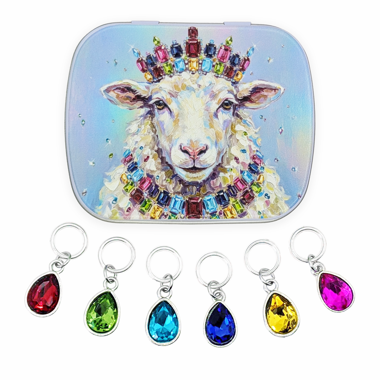 A square compact-style case with rounded corners featuring a colorful illustration of a sheep wearing a jeweled crown and necklace, shown above six matching teardrop ring style gem stitch markers in red, green, blue, dark blue, yellow, and pink on a white background.