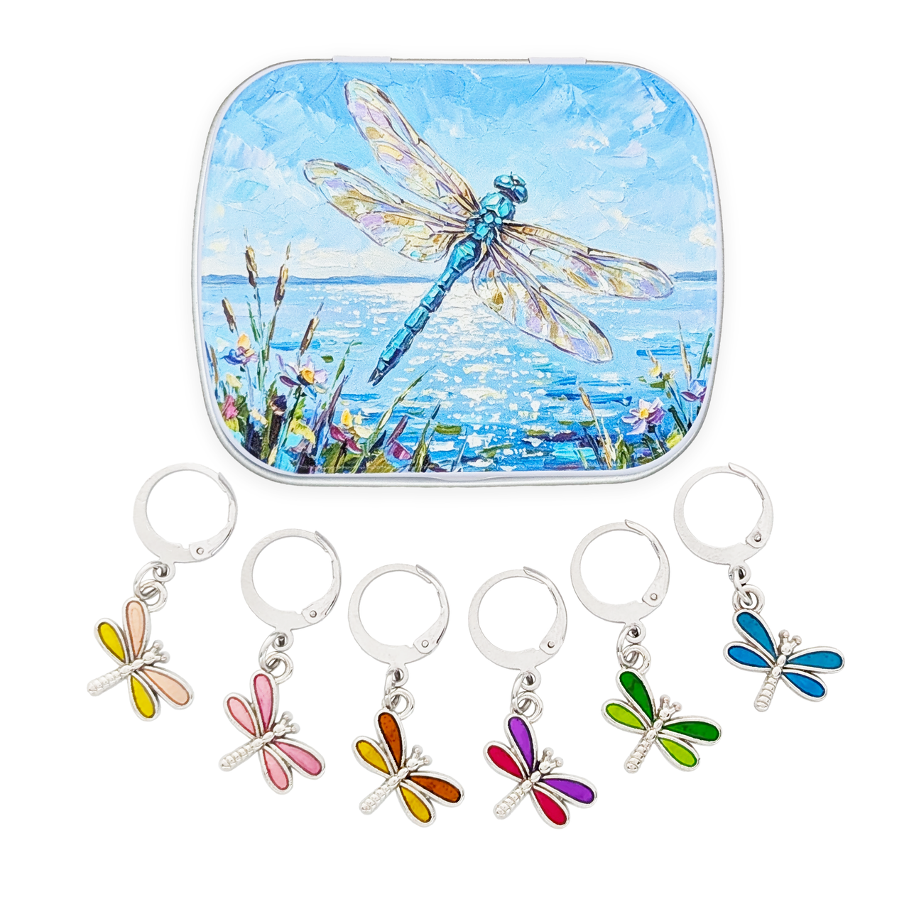 A square metal tin with rounded corners featuring a painted blue dragonfly over water, shown above five locking stitch markers decorated with colorful dragonfly wings in yellow, pink, orange, purple, and green.