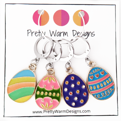 Set of 4 Easter egg themed removable stitch markers for crochet or knitting shown on Pretty Warm Designs cardstock