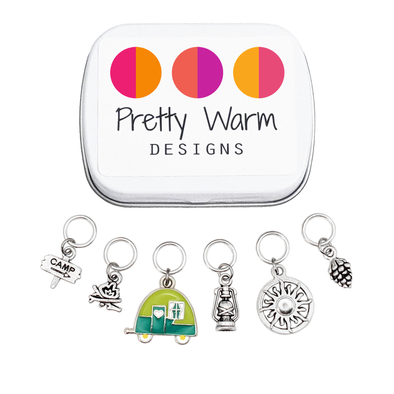 Go Camping Stitch Markers Set of 6 with Storage Tin, including Camp Sign, Bonfire, Camper, lantern, sun, and pinecone
