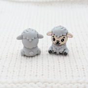Front and back view of London Fog Feeling Sheepish sheep stitch stoppers on white knit fabric