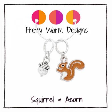 A brown enamel squirrel and silver acorn charm stitch marker duo for knitting, shown on a "Pretty Warm Designs" product card.