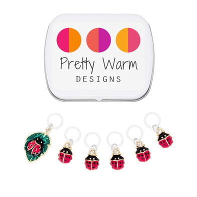 Set of five red and black enamel ladybug and one red, black and green ladybug on a leaf charms snag free ring stitch markers with storage tin by Pretty Warm Designs
