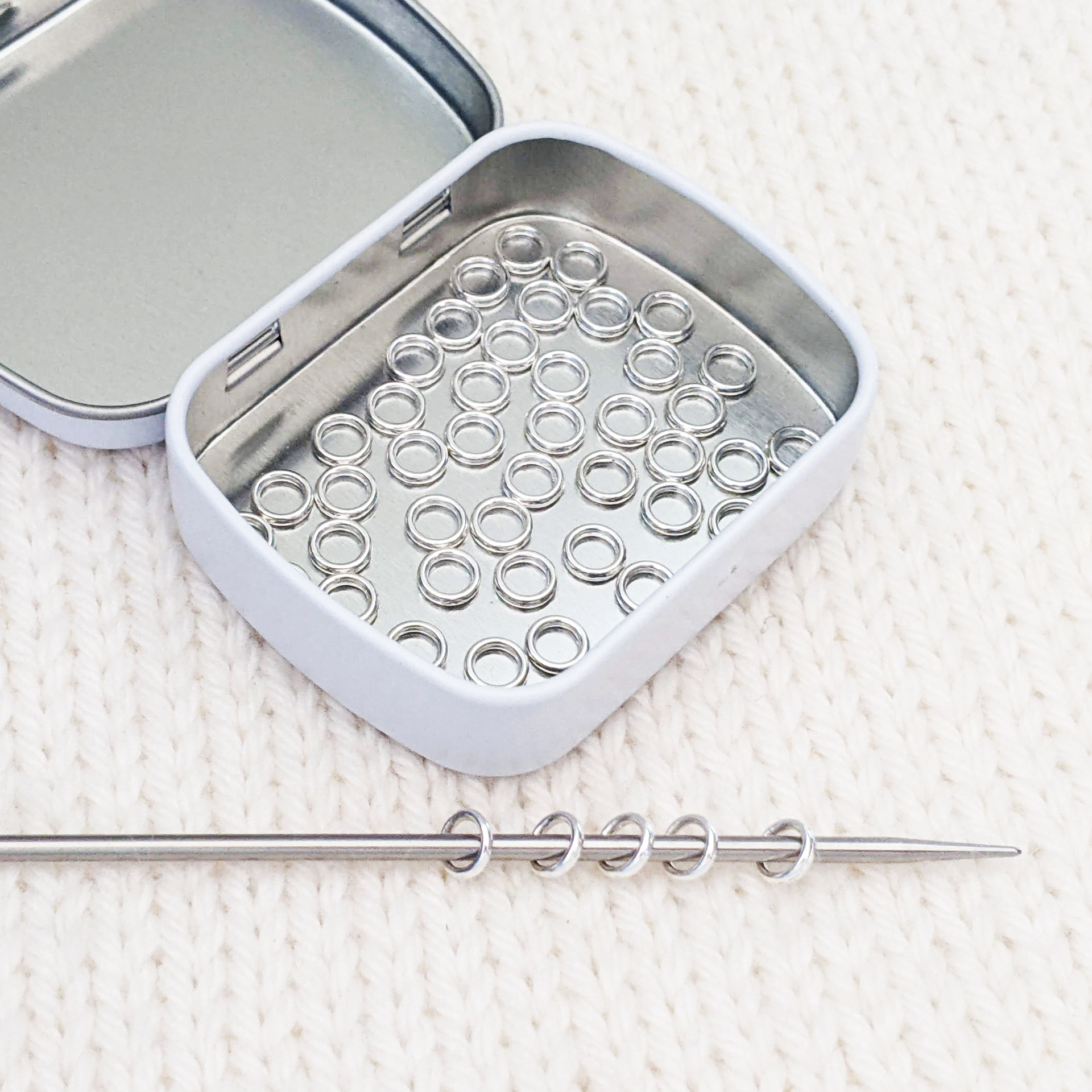 Set of 50 mini ring stitch markers with tin on needle for knitting by Pretty Warm Designs