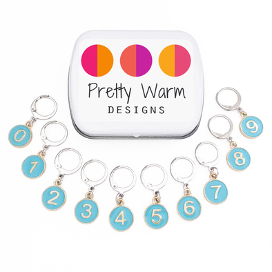 Set of ten powder blue enamel on gold toned charms locking stitch markers with storage tin for crochet by Pretty Warm Designs