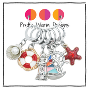 Pretty Warm Designs ocean theme locking stitch markers set of 6 featuring life preserver, sailboat, and starfish charms for fiber arts.