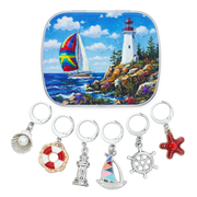 Set of 6 nautical theme locking stitch markers for knitting and crochet, featuring a sailboat and lighthouse, with a matching storage tin