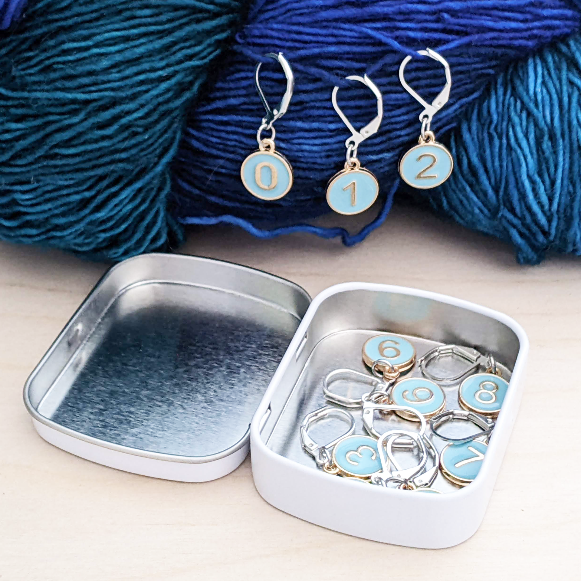 Set of ten powder blue enamel on gold toned charms locking stitch markers for crochet by Pretty Warm Designs