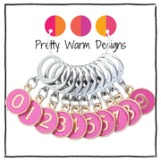 Set of 10 locking stitch markers with stainless steel leverback clasps, charms numbered 0 - 9 in rose pink