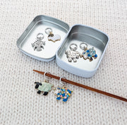 Sheep charm stitch markers stored in silver tin — knitting accessories gift set for knitters who love sheep