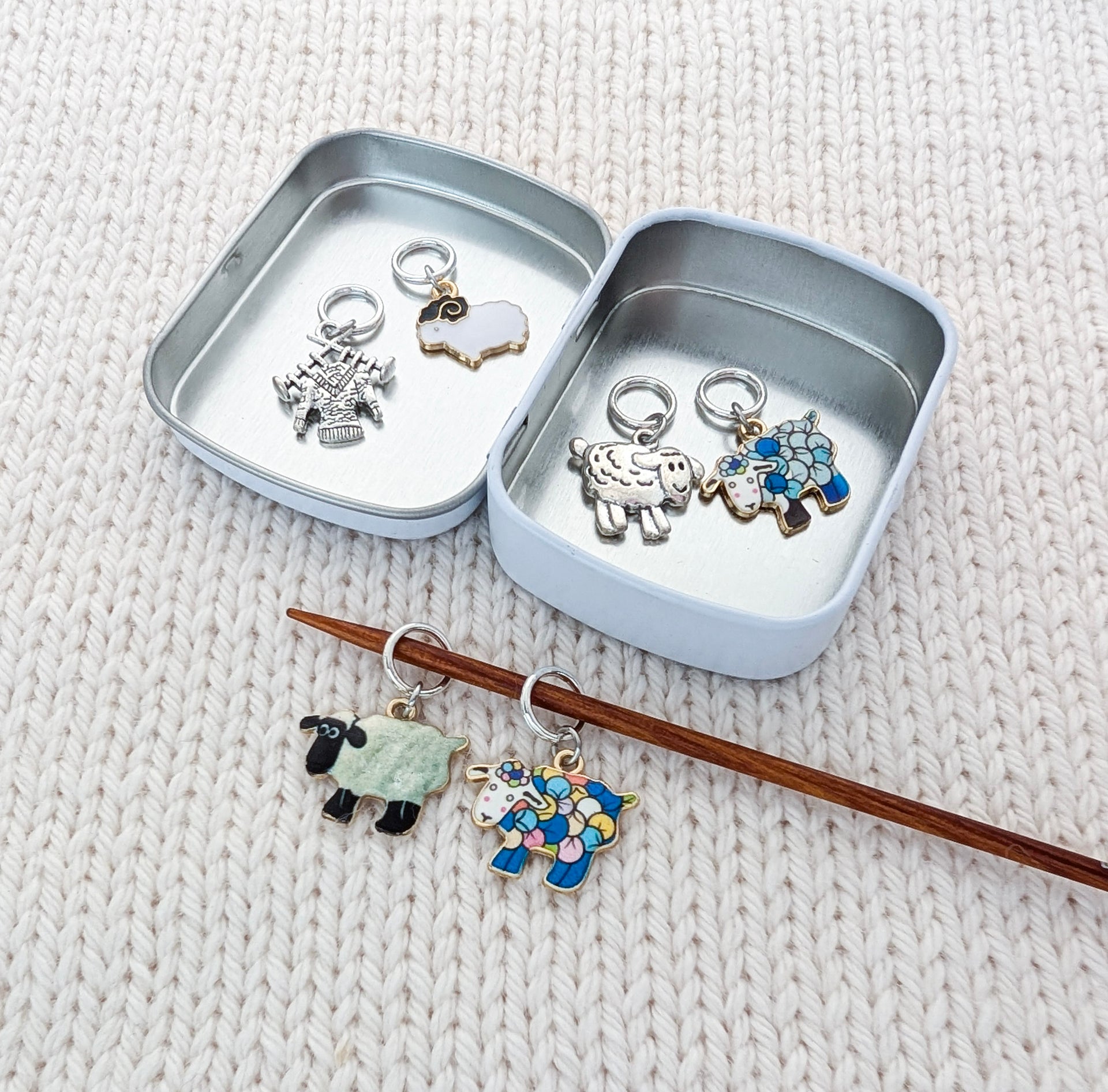 Sheep charm stitch markers stored in silver tin — knitting accessories gift set for knitters who love sheep