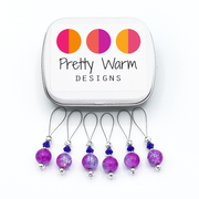 Set of six pink and lavender crackle glass beads, blue bicone crystal beads, perforated silver beads, silver accents on wire stitch markers with tin for knitting by Pretty Warm Designs