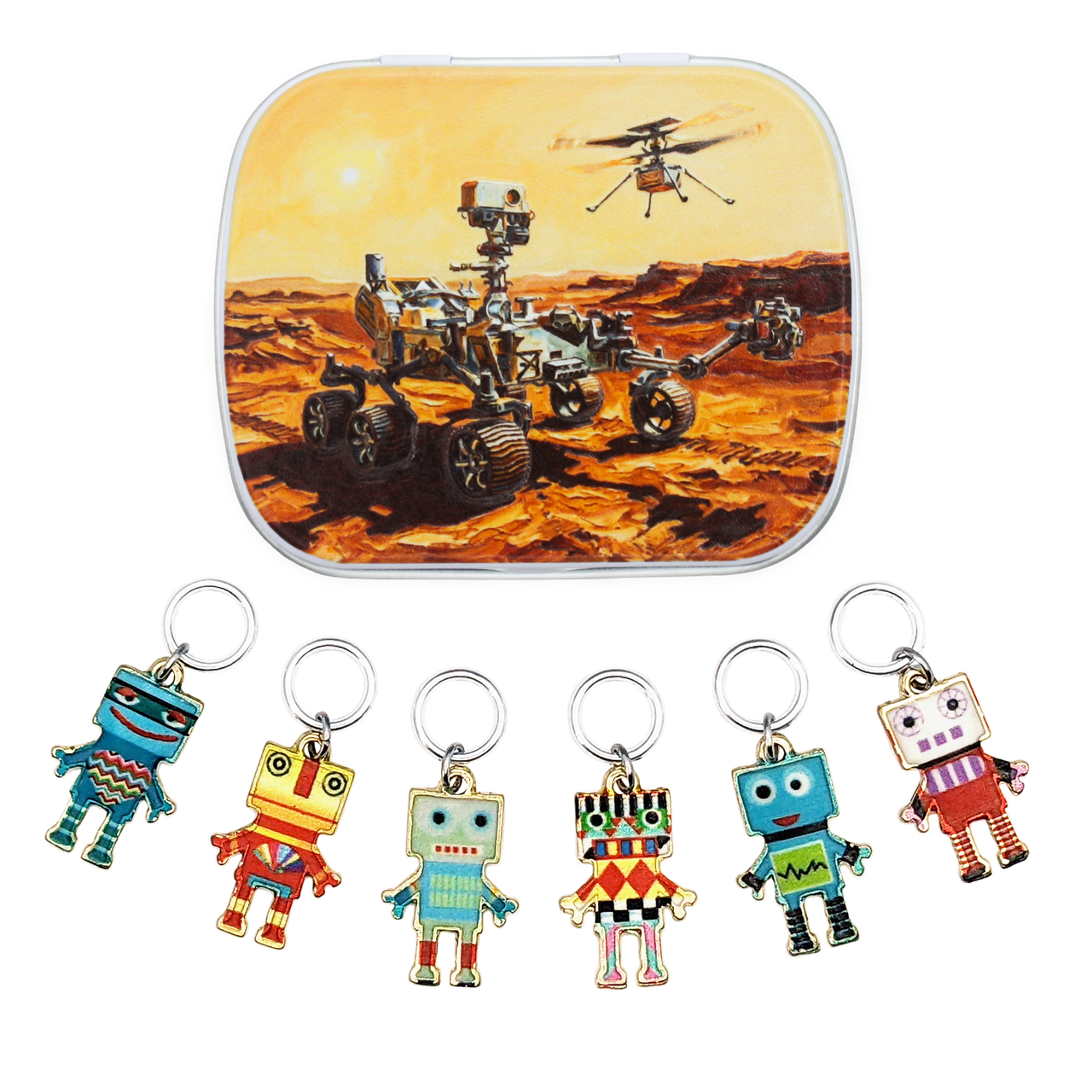 A hinged metal notions tin featuring an illustration of a Mars rover and a helicopter on Mars, shown above six colorful robot ring style stitch markers for knitters.