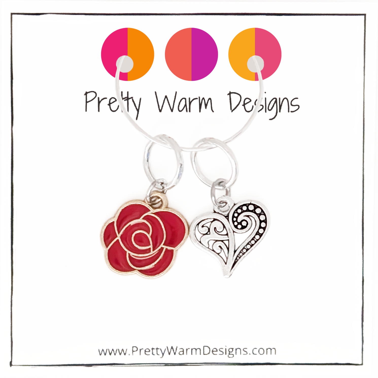 Two Valentine's Day themed knitting ring stitch markers, one red rose and one Tibetan antiqued silver filigree heart with Pretty Warm Designs text and logo