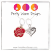 Two Valentine's Day themed knitting ring stitch markers, one red rose and one Tibetan antiqued silver filigree heart with Pretty Warm Designs text and logo