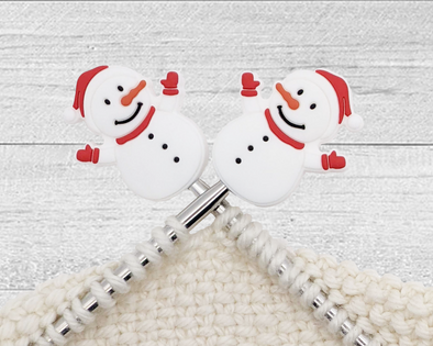 two Christmas Snowman stitch stoppers for knitting with red hat, scarf, and mittens