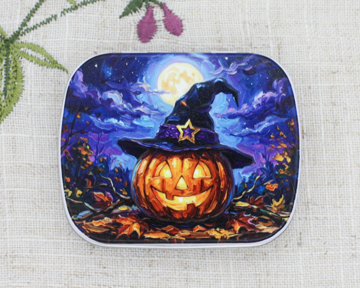 Spooky Season Halloween themed notions storage tin with Jack-o-Lantern & Witch's Hat artwork under a full moon