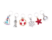 Nautical Treasures Stitch Markers, Set of 6 without tin. Includes sailboat, lighthouse, life ring, ship's wheel, starfish, and pearl oyster ring markers for knitting.