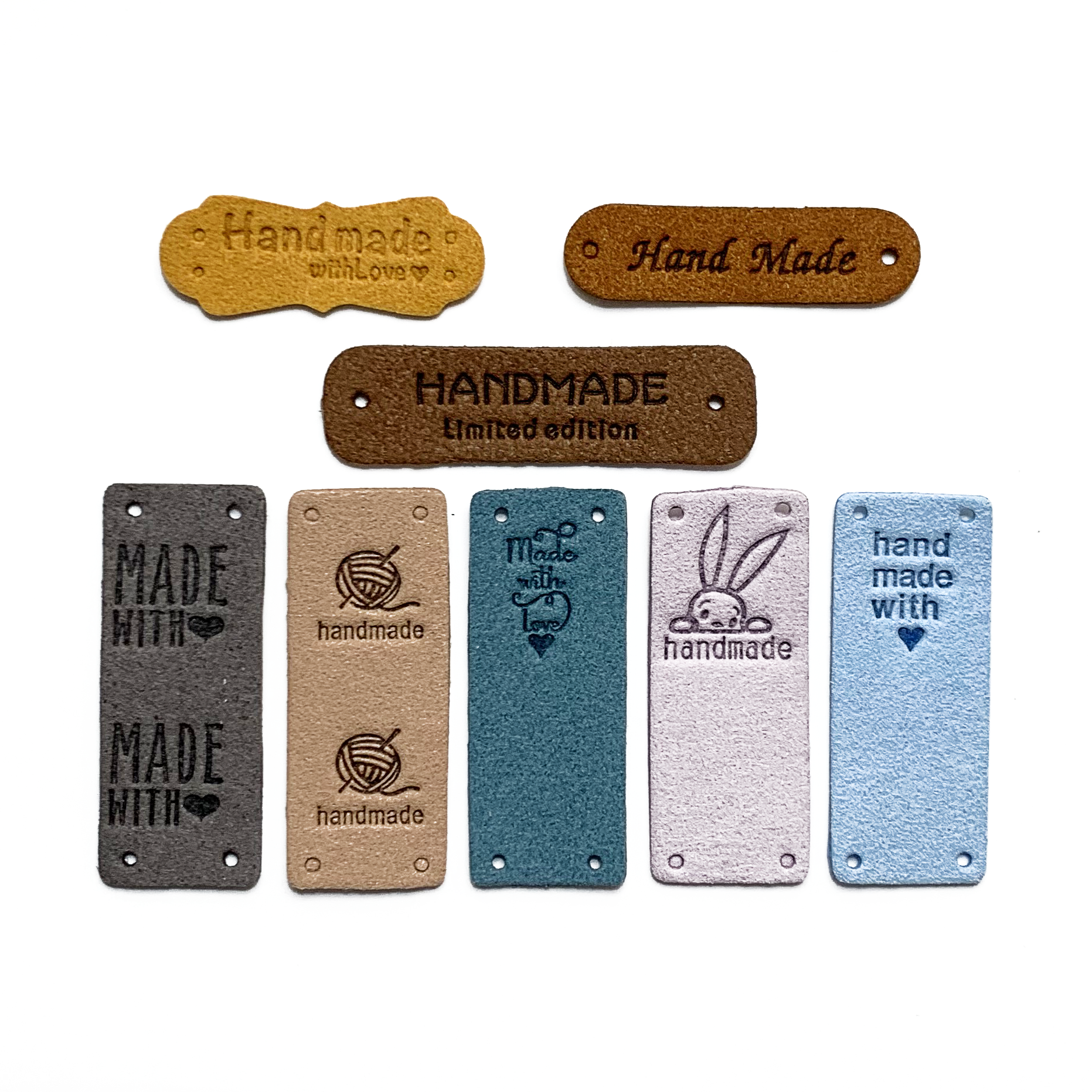Eight assorted colours and designs of PU vegan polyurethane leather garment label tags for knitted and crocheted projects sold by Pretty Warm Designs Inc.