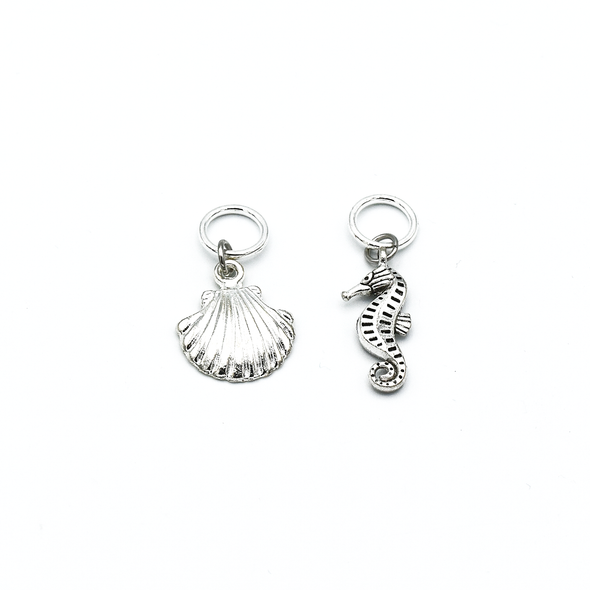 Two silver toned sea shell and sea horse charms snag free ring stitch markers with tin for knitting by Pretty Warm Designs