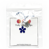 Two knitting stitch markers include one blue flower and one silver plated hand stamped with Hand Made charm attached with blue yarn to white cardstock printed with Pretty Warm Designs logo and text packaged in a clear poly bag