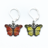 Two enamel butterfly charm crochet locking stitch markers in red and yellow for crochet by Pretty Warm Designs