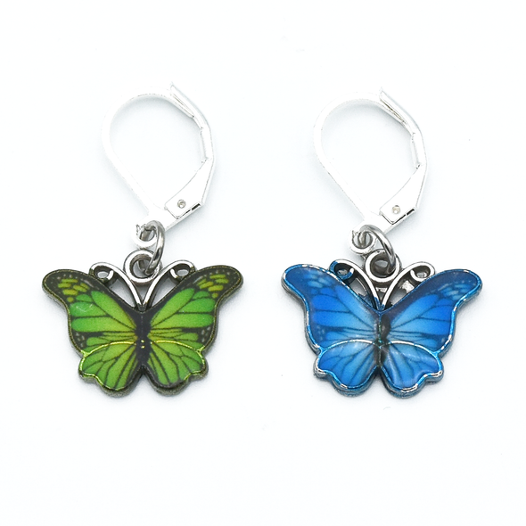 Two enamel butterfly charm crochet locking stitch markers in green and blue for crochet by Pretty Warm Designs