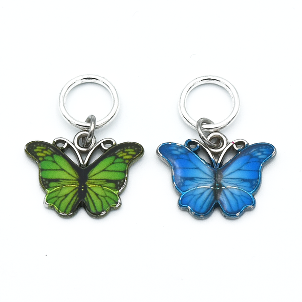 Two enamel butterfly charm snag free ring stitch markers in green and blue for knitting by Pretty Warm Designs