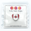 Packaged red and white enamel on heart shaped silver metal Canadian flag pin for project bags by Pretty Warm Designs