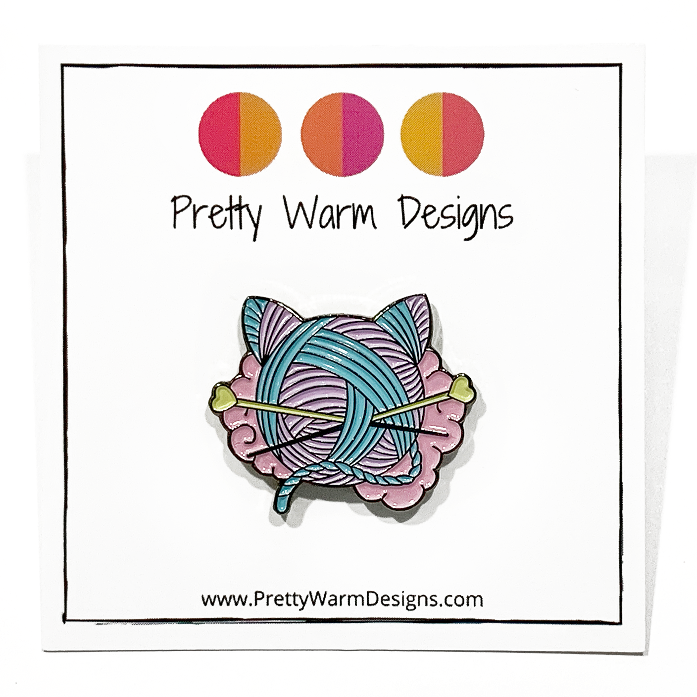 Pink, turquoise and yellow enamel on black background cat shaped yarn knitting pin by Pretty Warm Designs