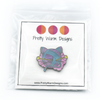 Packaged pink, turquoise and yellow enamel on black background cat shaped yarn knitting pin by Pretty Warm Designs