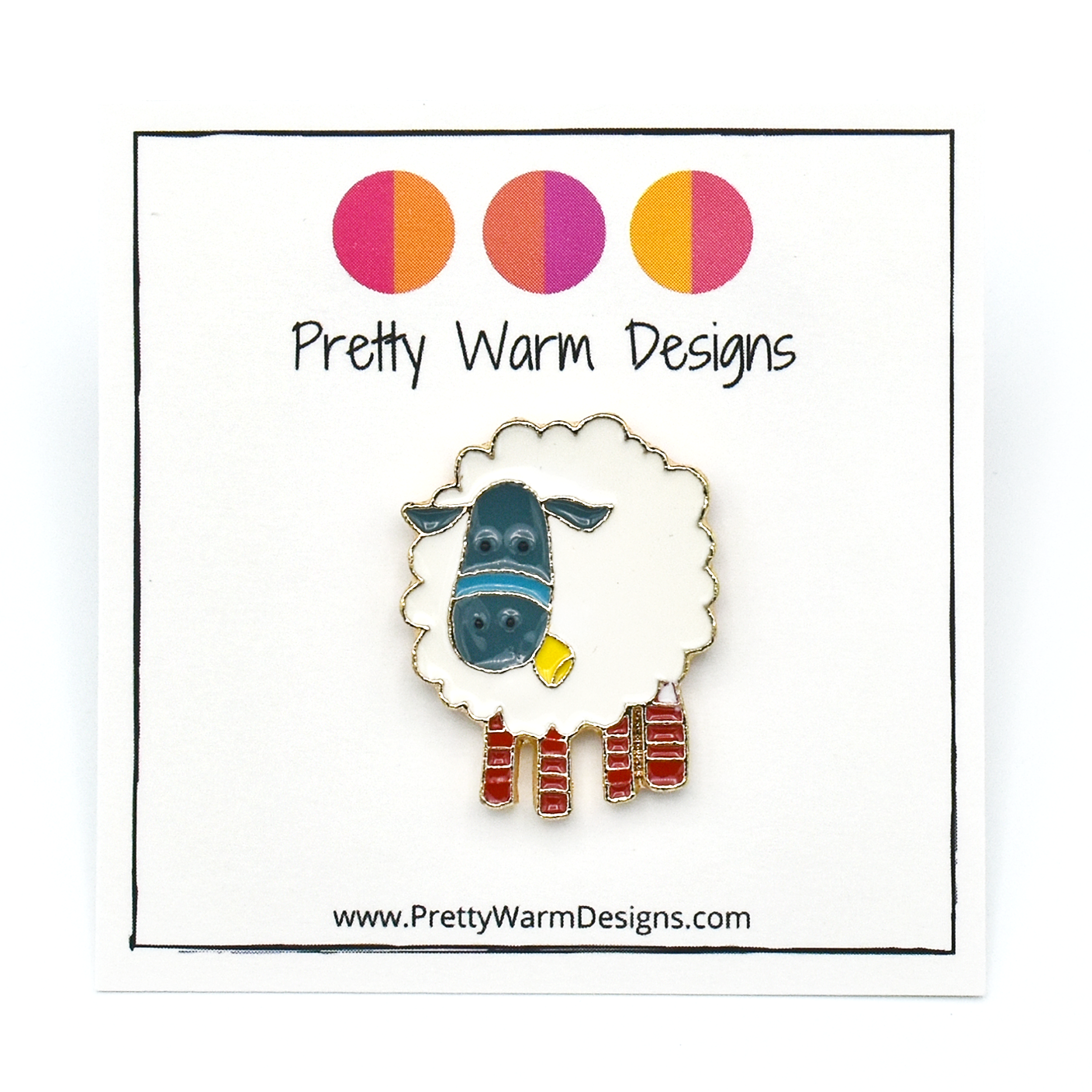 White, teal, yellow and red enamel on gold toned metal sheep pin by Pretty Warm Designs