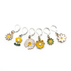 Set of six white, yellow and green enamel daisy charms with silver plated lever back clasps stitch markers for crochet by Pretty Warm Designs