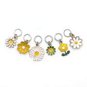 Set of six white, yellow and green enamel daisy charms snag free ring stitch markers with for knitting by Pretty Warm Designs